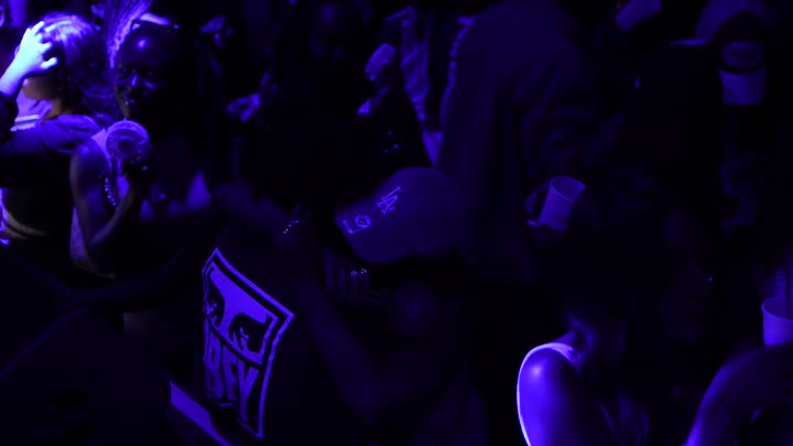 the room singing together under blue lights